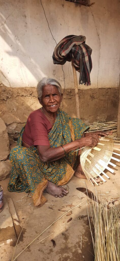 Shantabai Sedam working as a basket maker in India. 